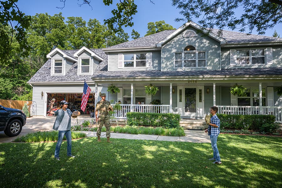 Service member plays catch with sons